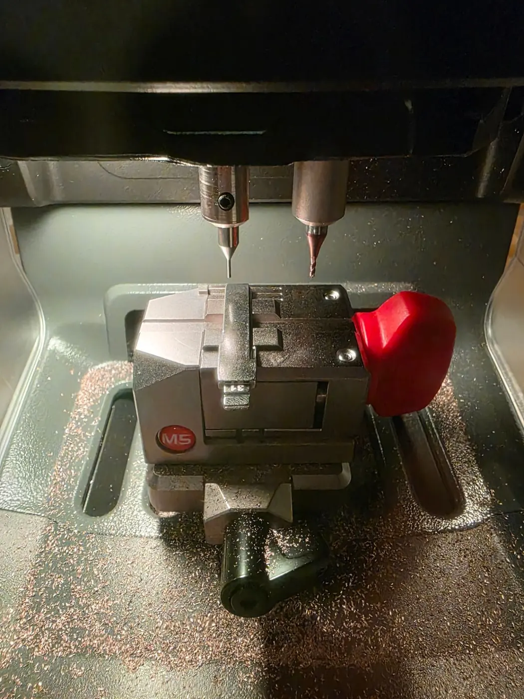 Professional key cutting machine cutting a new key for a customer in Fermanagh